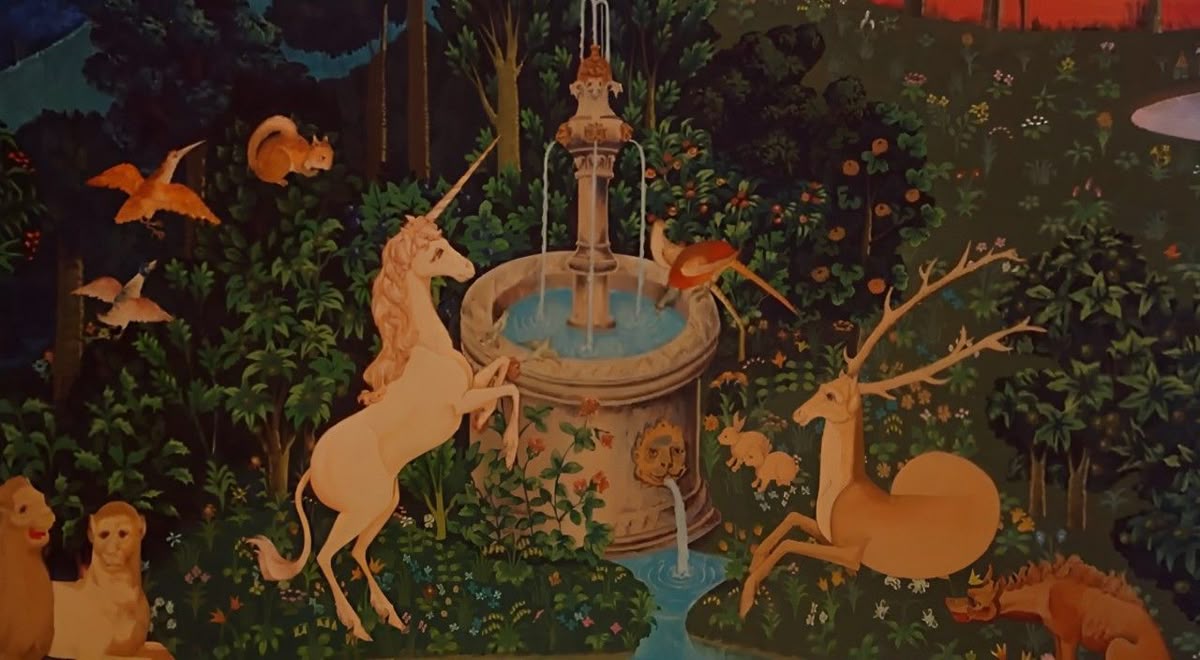 Enchanted forest scene with mythical creatures gathered around a central fountain, featuring a unicorn, deer, and various animals among lush vegetation and trees